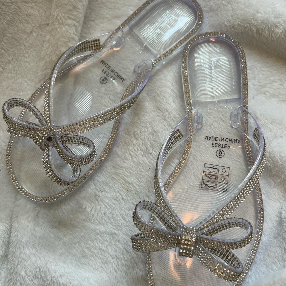 Nicole Miller clear rhinestoned flip flops